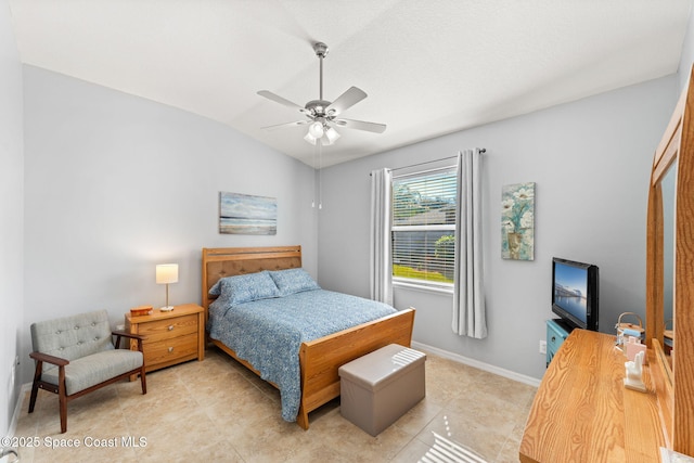 tiled bedroom featuring ceiling fan and lofted ceiling