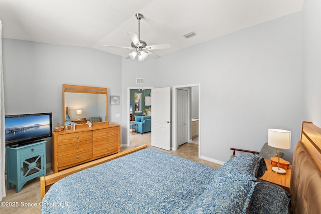 carpeted bedroom with ceiling fan, connected bathroom, and vaulted ceiling