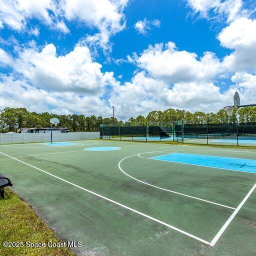 view of basketball court featuring tennis court