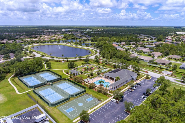 birds eye view of property with a water view