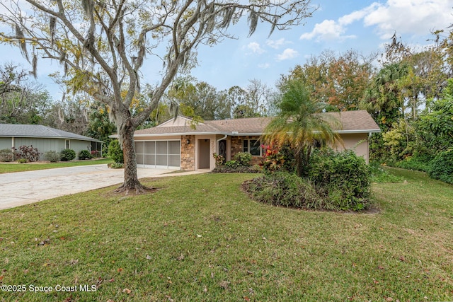 ranch-style home featuring a garage and a front lawn