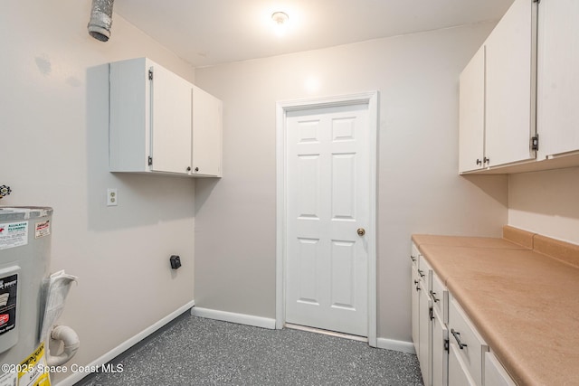 laundry area with electric water heater