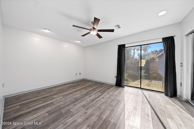 unfurnished room featuring ceiling fan and light wood-type flooring