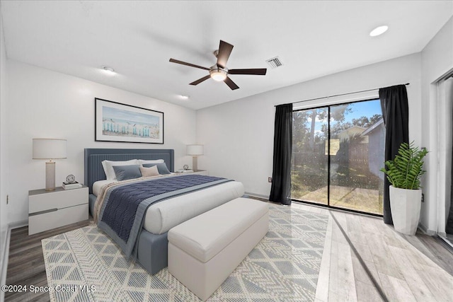 bedroom with ceiling fan and wood-type flooring