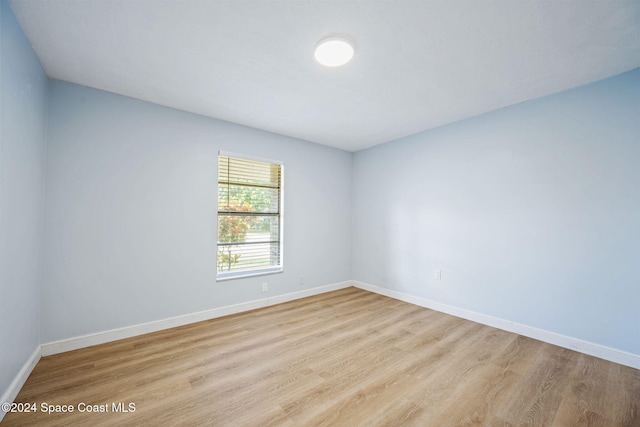 unfurnished room featuring light hardwood / wood-style flooring