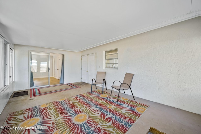 sitting room featuring concrete floors