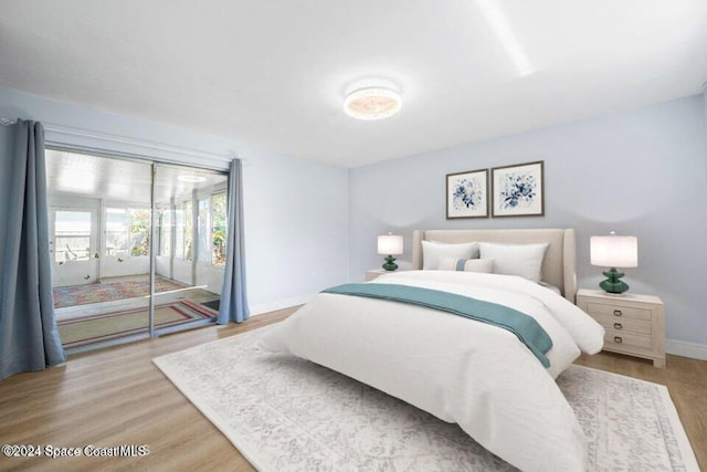 bedroom with light hardwood / wood-style floors