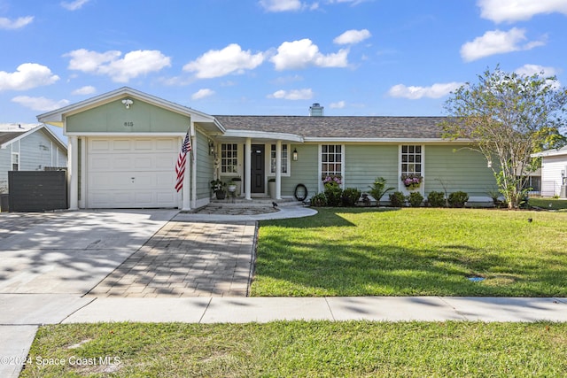 ranch-style home with a front yard and a garage