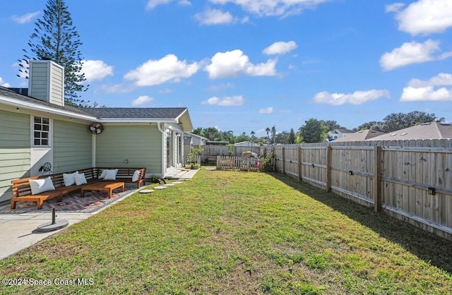 view of yard featuring a patio area and an outdoor hangout area