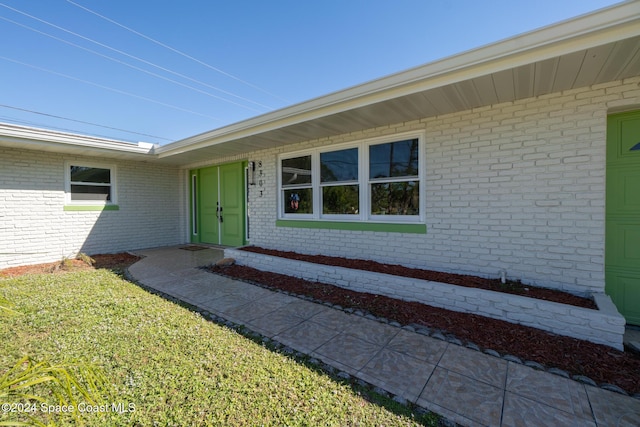 8303 Sylvan Dr, Melbourne, FL 32904 - property entrance with brick siding