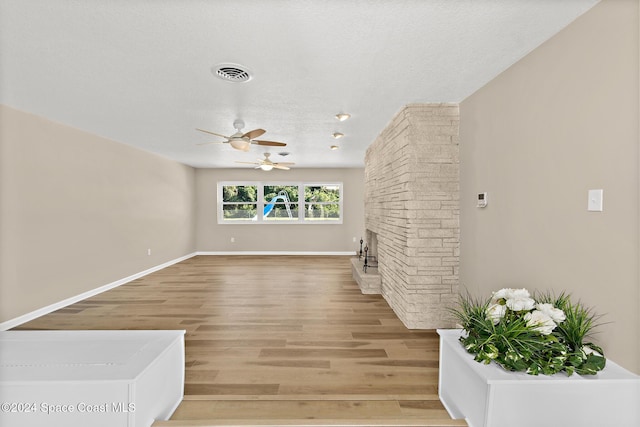 8303 Sylvan Dr, Melbourne, FL 32904 - unfurnished living room featuring light wood finished floors, ceiling fan, and baseboards