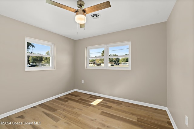 unfurnished room featuring ceiling fan and wood-type flooring