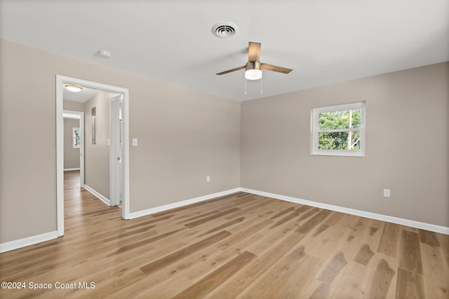 8303 Sylvan Dr, Melbourne, FL 32904 - empty room featuring a ceiling fan, light wood-style flooring, and baseboards
