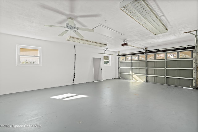 8303 Sylvan Dr, Melbourne, FL 32904 - garage featuring a garage door opener
