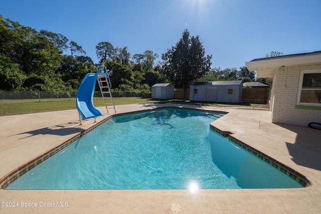 8303 Sylvan Dr, Melbourne, FL 32904 - view of pool featuring a water slide and a patio