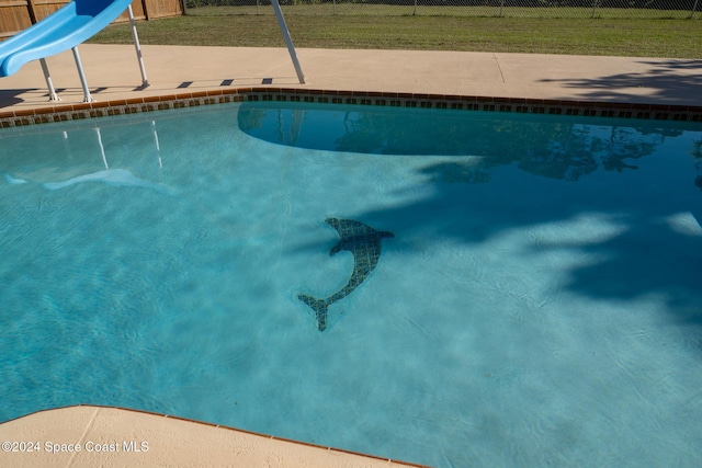 8303 Sylvan Dr, Melbourne, FL 32904 - view of pool featuring a water slide