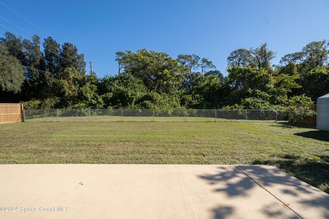 8303 Sylvan Dr, Melbourne, FL 32904 - view of yard featuring a patio area
