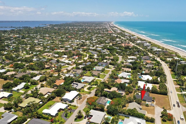 bird's eye view featuring a beach view and a water view