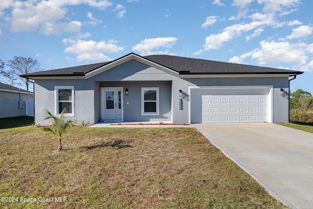 ranch-style house with a garage and a front lawn