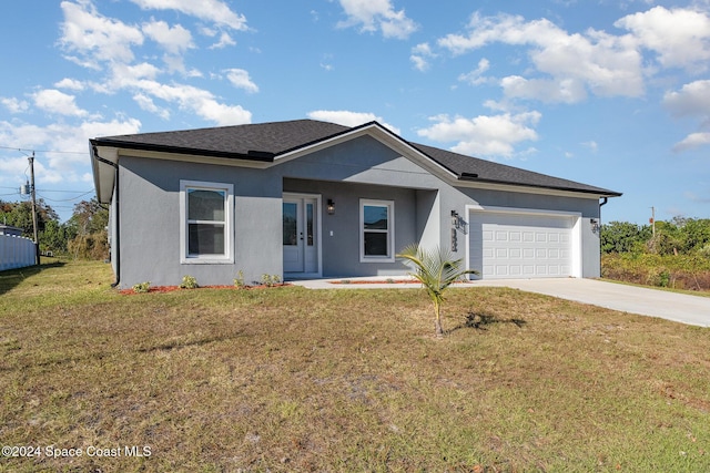 ranch-style home featuring a front lawn and a garage