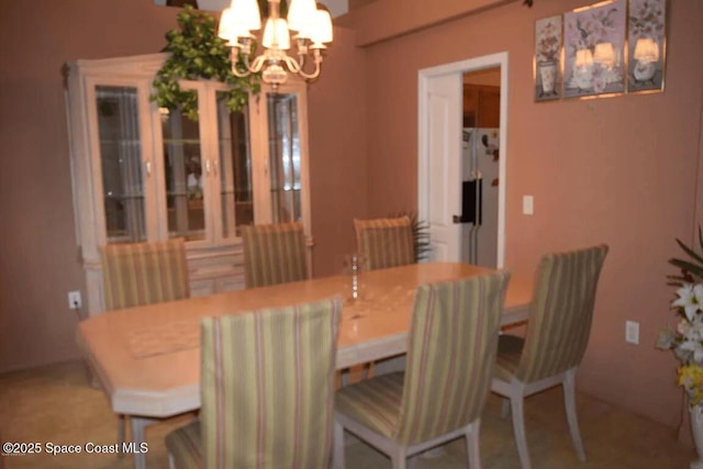 dining room with a chandelier