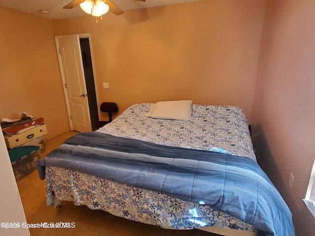 bedroom featuring ceiling fan and carpet floors