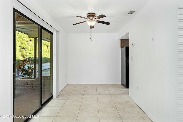 unfurnished room featuring ceiling fan and light tile patterned flooring