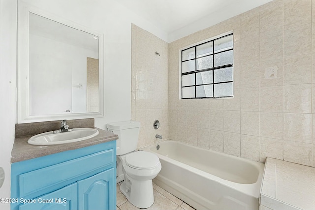 full bathroom featuring tile patterned floors, toilet, vanity, and tiled shower / bath