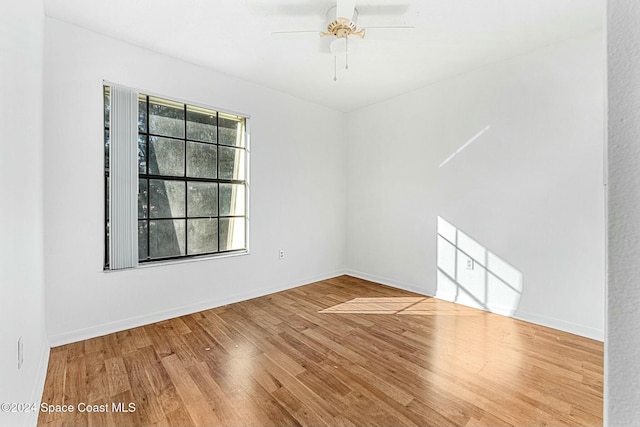 unfurnished room featuring hardwood / wood-style flooring and ceiling fan