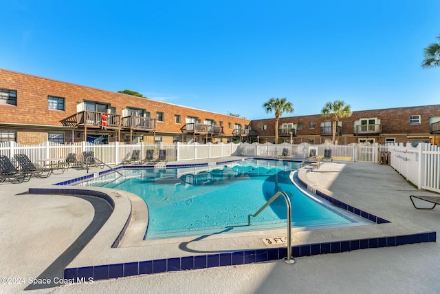 view of swimming pool featuring a patio