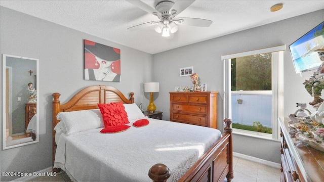 bedroom featuring ceiling fan and multiple windows