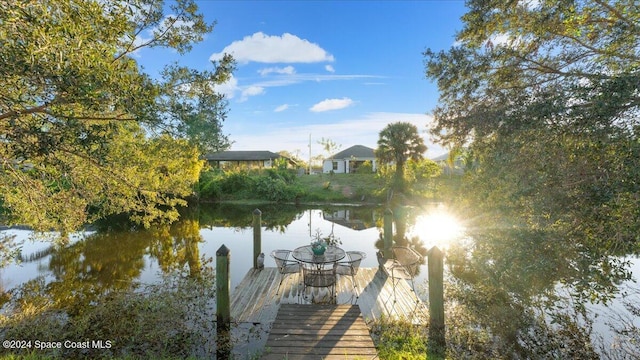 dock area featuring a water view