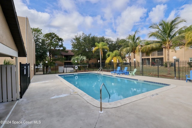 view of pool featuring a patio