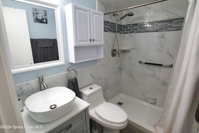 bathroom featuring vanity, toilet, and walk in shower