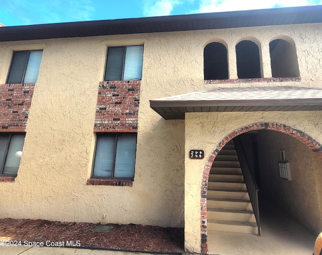 144 San Paulo Cir Unit 10-144, West Melbourne, FL 32904 - property entrance featuring stucco siding