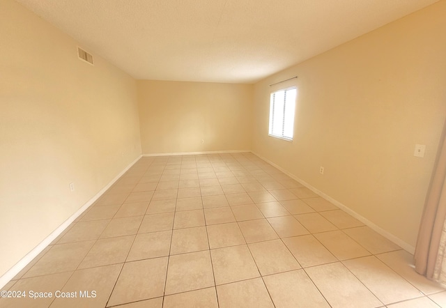 144 San Paulo Cir Unit 10-144, West Melbourne, FL 32904 - unfurnished room featuring light tile patterned floors and baseboards