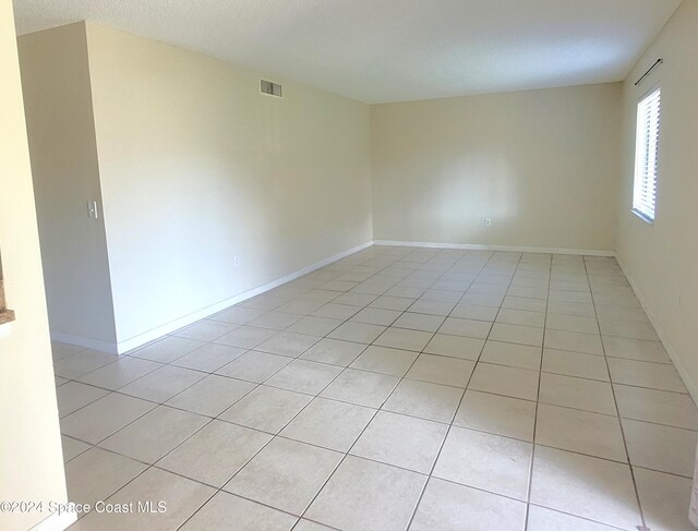 144 San Paulo Cir Unit 10-144, West Melbourne, FL 32904 - empty room with light tile patterned floors and baseboards