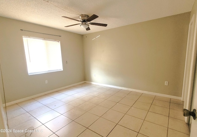 144 San Paulo Cir Unit 10-144, West Melbourne, FL 32904 - unfurnished room with ceiling fan, light tile patterned floors, and a textured ceiling