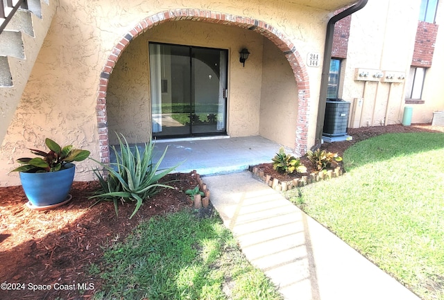 144 San Paulo Cir Unit 10-144, West Melbourne, FL 32904 - doorway to property featuring stucco siding