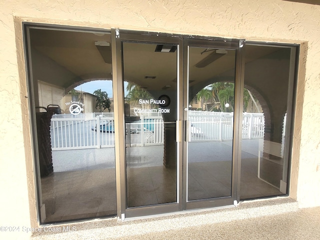 144 San Paulo Cir Unit 10-144, West Melbourne, FL 32904 - doorway to property with stucco siding