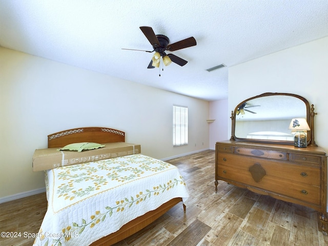 bedroom featuring ceiling fan and light hardwood / wood-style flooring