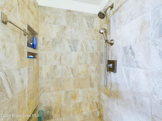 bathroom with tiled shower