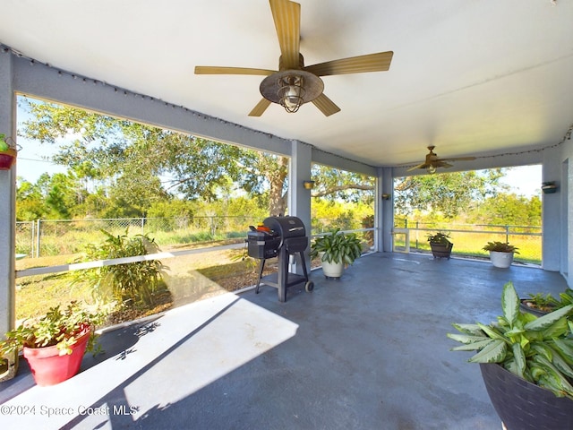 view of patio featuring ceiling fan and a grill