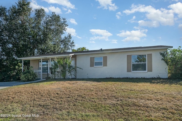 ranch-style house with a front lawn