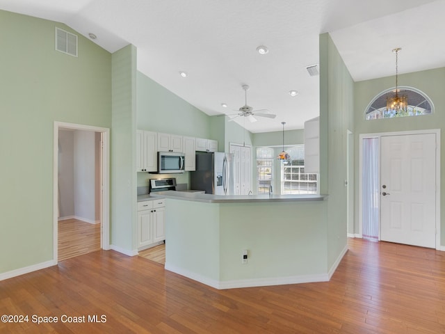 kitchen featuring white cabinetry, stainless steel appliances, and light hardwood / wood-style floors