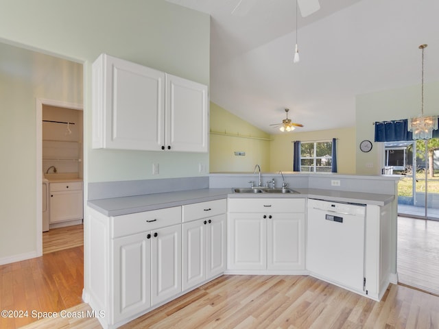 kitchen featuring white cabinetry, sink, kitchen peninsula, white dishwasher, and vaulted ceiling