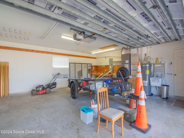 garage with a garage door opener, electric water heater, and electric panel