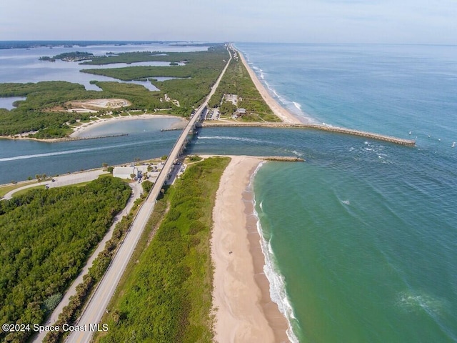 drone / aerial view featuring a view of the beach and a water view