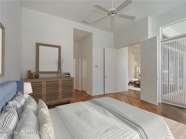 bedroom with hardwood / wood-style floors and ceiling fan