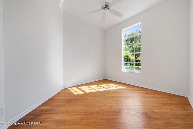 empty room featuring ceiling fan and light hardwood / wood-style floors